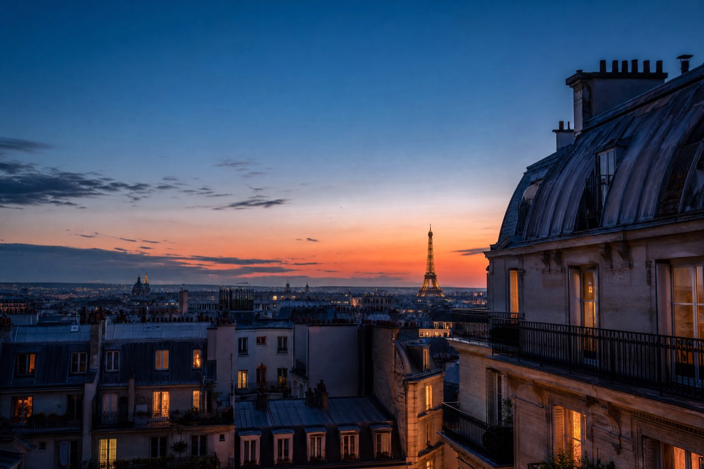 Paris rooftops and the Eiffel Tower at blue hour